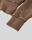 Closeup of vintage washed fabric and ribbed sleeve cuff on Vintage Washed Edition Hoodie