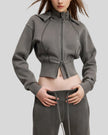 Three-quarter front view of woman wearing Vintage Washed Edition Hoodie with fitted ribbed waistband in Dark Gray