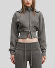 Mid body front view of woman wearing Vintage Washed Edition Hoodie in Dark Gray