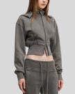 Mid body side view of woman wearing Vintage Washed Edition Hoodie in Dark Gray