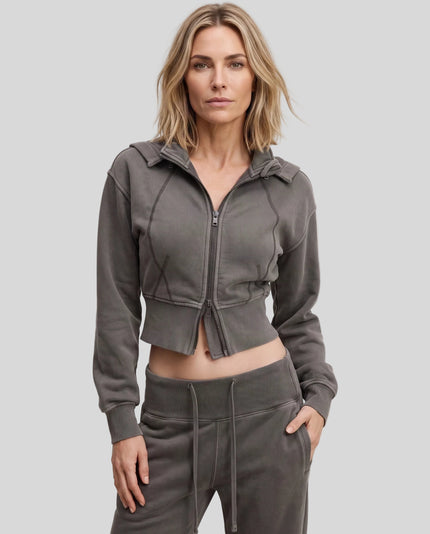 Upper body front view of woman wearing Vintage Washed Edition Hoodie in Dark Gray