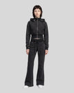 Full body front view of woman styling Vintage Washed Edition Hoodie and matching Pants in Black