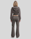 Full body back view of woman styling Vintage Washed Edition Hoodie and matching Pants in Dark Gray