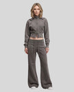 Full body front view of woman styling Vintage Washed Edition Hoodie and matching Pants in Dark Gray