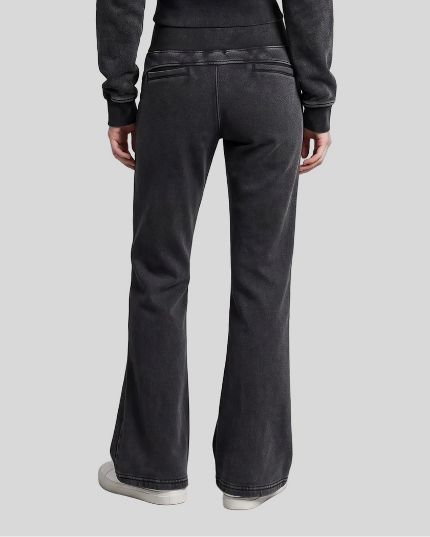 Lower body back view of woman wearing Vintage Washed Edition Pants in Black with flared leg silhouette