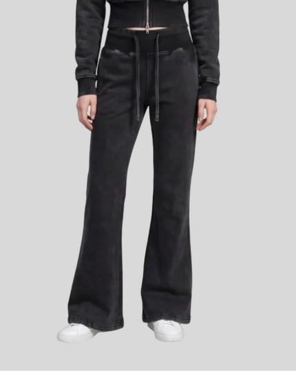 Lower body front view of woman wearing Vintage Washed Edition Pants in Black, showing flared leg silhouette