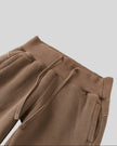 Closeup of wide ribbed waistband, adjustable drawstring and front pockets on Vintage Washed Edition Pants