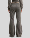 Lower body back view of woman wearing Vintage Washed Edition Pants in Dark Gray with flared leg silhouette