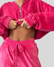 Front closeup of hot pink zip lounge top and pants