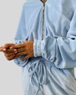 Sleeve cuff detail on light blue lounge zip top