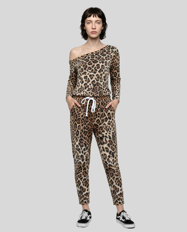 Model wearing Athlesi one-shoulder leopard top and pant set full body front