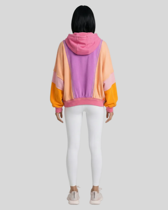 Back view of the AuraShift Colorblock Hoodie styled with Athlesi essentials