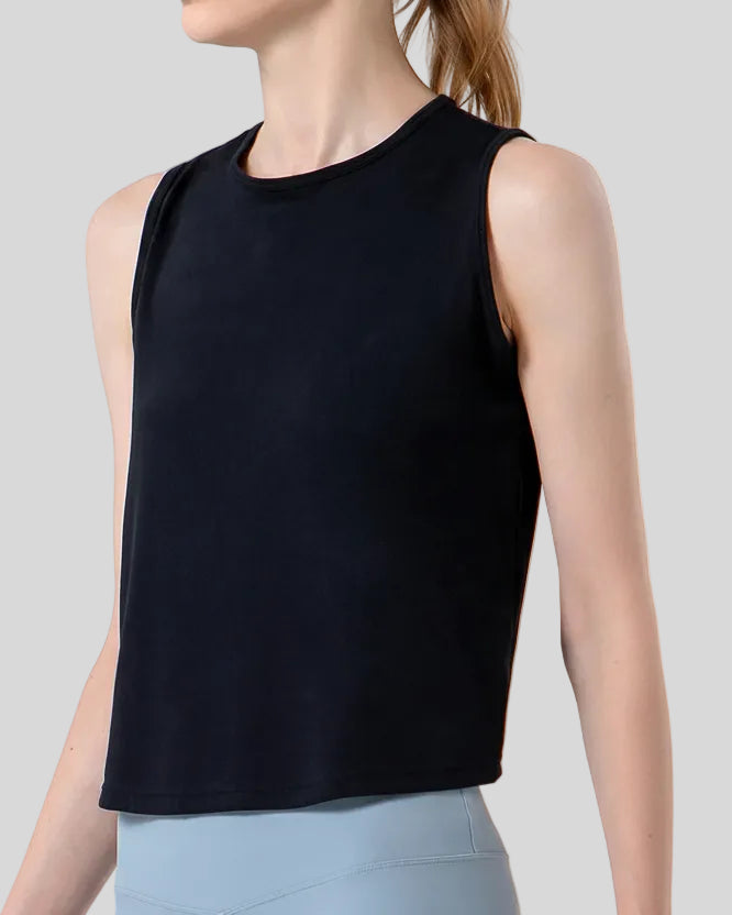 CoreLine Active Tank in black, angled front view showing smooth fabric and waist-length cut
