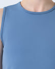 Close-up of CoreLine Active Tank fabric and round neckline detail in dusty blue