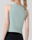 Close-up back detail of CoreLine Active Tank in light green, smooth and opaque fabric