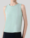 Close-up of CoreLine Active Tank fabric and round neckline detail in light green