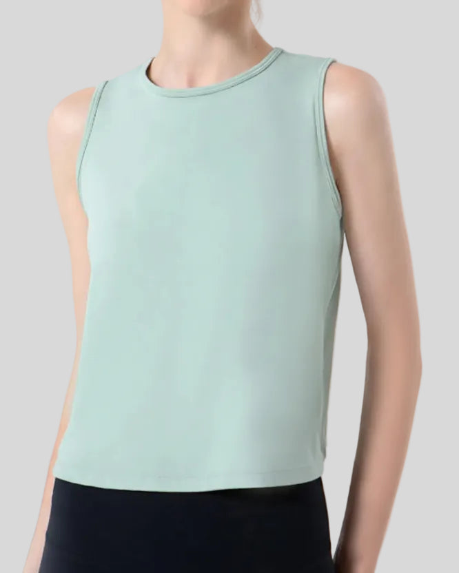 Close-up of CoreLine Active Tank fabric and round neckline detail in light green