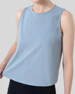 CoreLine Active Tank in light blue, angled front view showing smooth fabric and waist-length cut