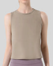 Close-up of CoreLine Active Tank fabric and round neckline detail in tan