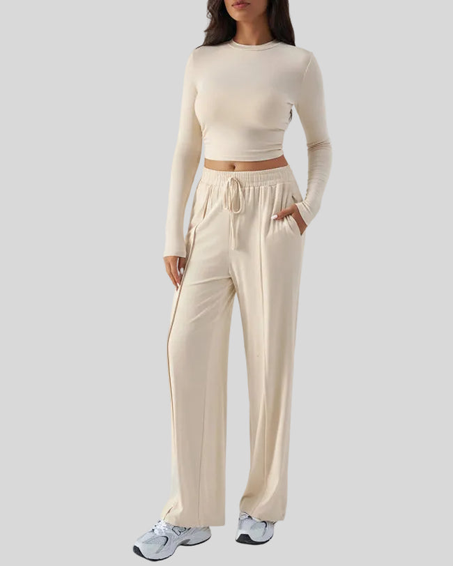 Side view of EaseLounge long-sleeve lounge set in Apricot showing fluid drape and relaxed silhouette