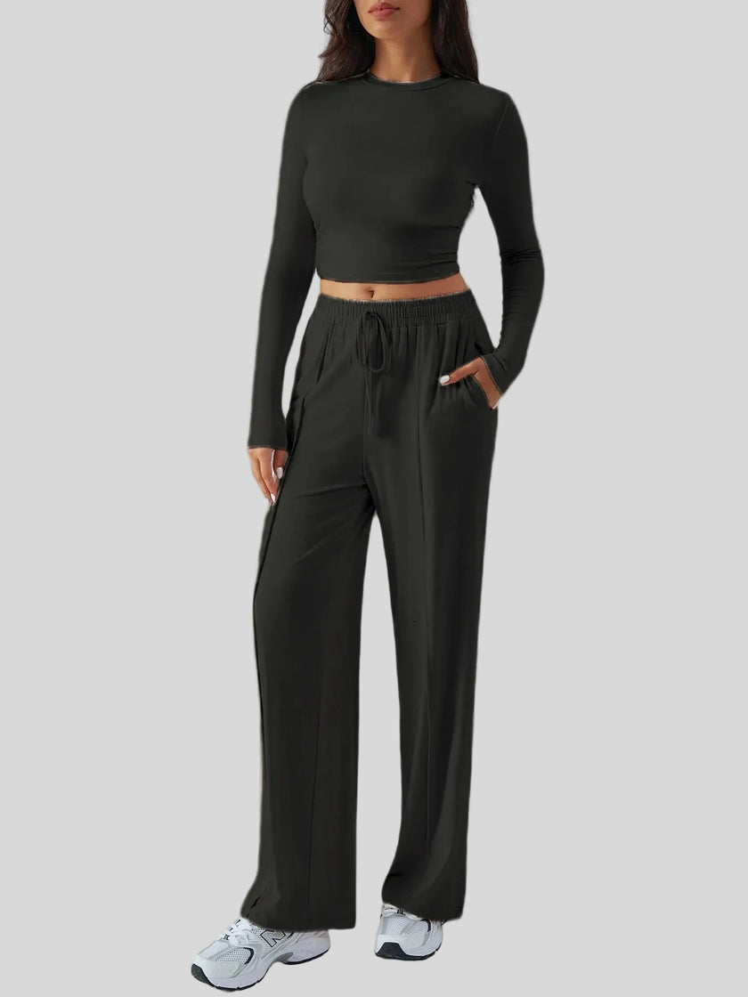 Side view of EaseLounge long-sleeve lounge set in Black showing fluid drape and relaxed silhouette