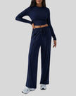 Side view of EaseLounge long-sleeve lounge set in Navy Blue showing fluid drape and relaxed silhouette