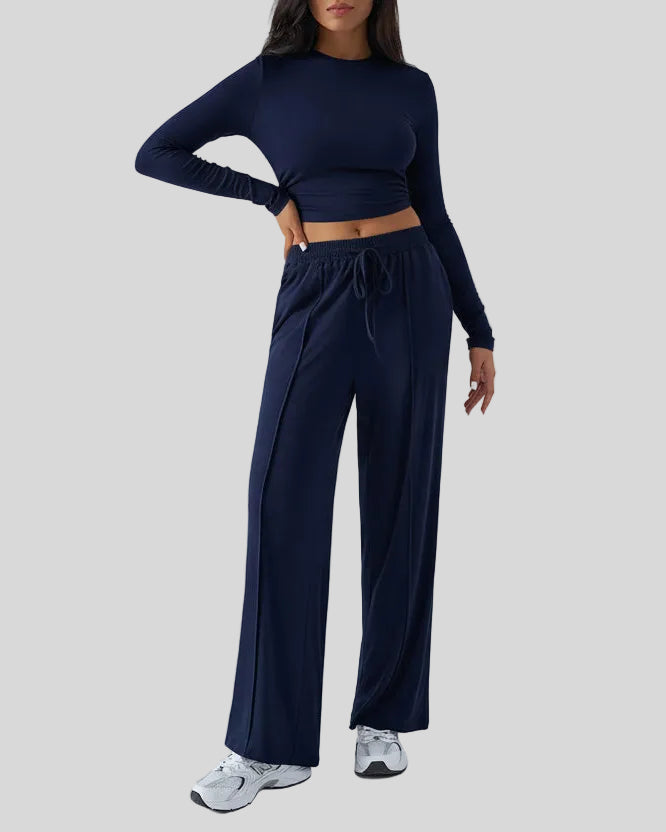 Side view of EaseLounge long-sleeve lounge set in Navy Blue showing fluid drape and relaxed silhouette