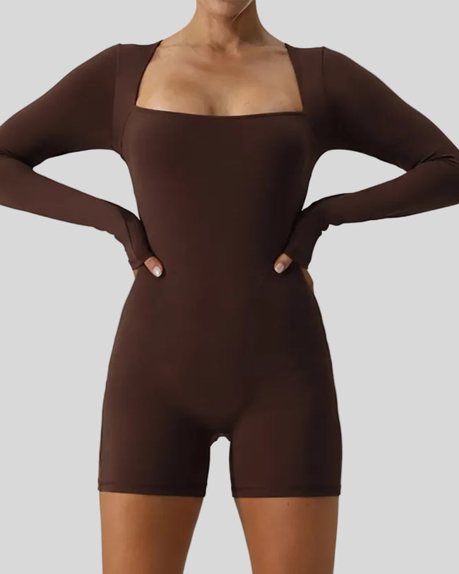 Front view closeup of Athlesi FormAlign Long Sleeve Romper in brown highlighting fit and neckline