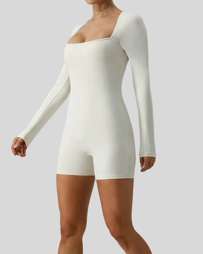 FormAlign long sleeve romper in ivory, angled front view showing sculpted fit