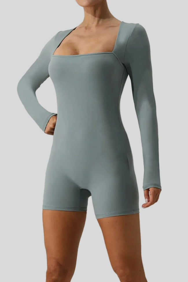 FormAlign long sleeve romper in light green, angled front view showing sculpted fit