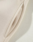 Close-up of functional pocket detail on UrbanFlow jacket in beige