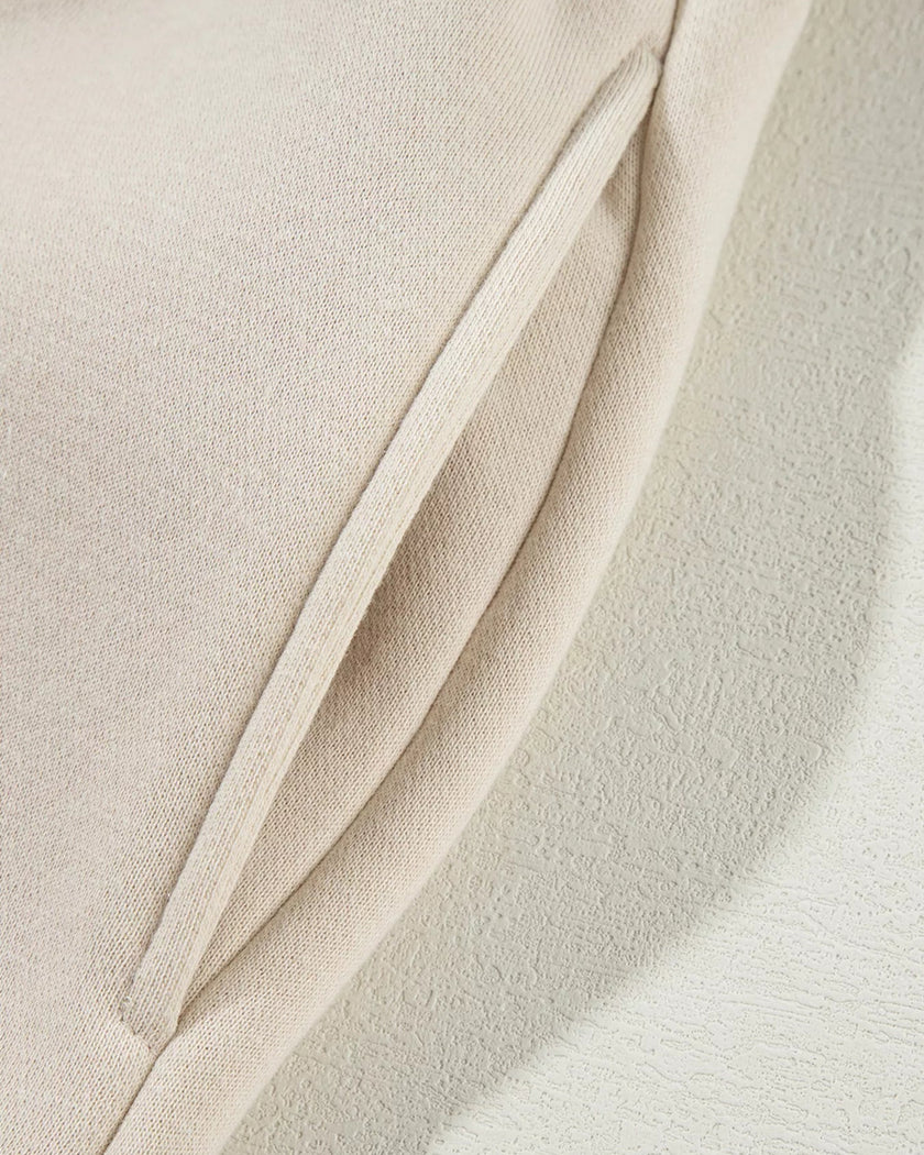Close-up of functional pocket detail on UrbanFlow jacket in beige
