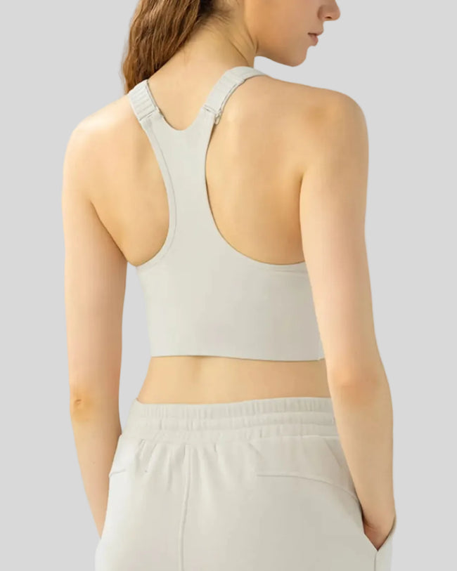 Back view of PureEase Essential Sports Bra in Ivory showing racerback design