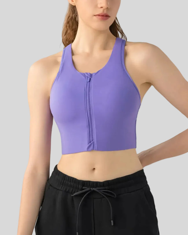 PureEase Essential Sports Bra in purple worn by model, featuring a wide straps and medium supportive fit