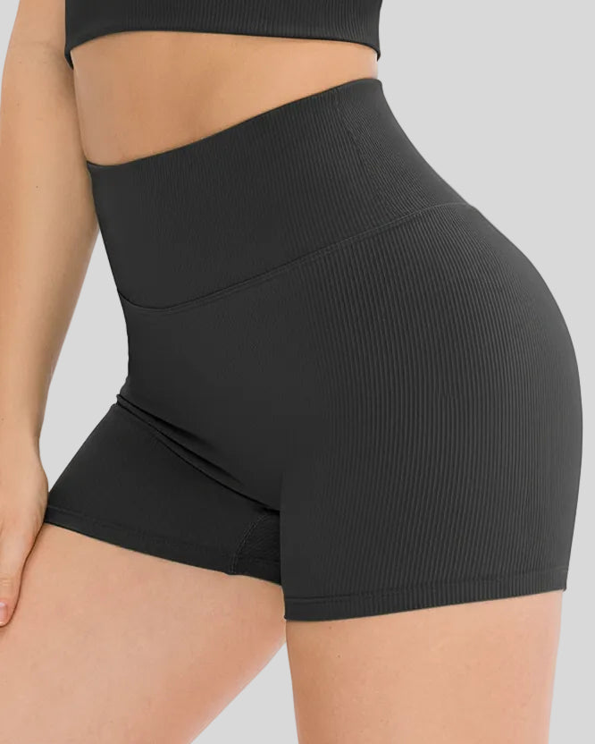 Side view of ribbed legging-style active short in black