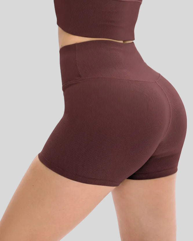 Side view of ribbed legging-style active short in burgundy