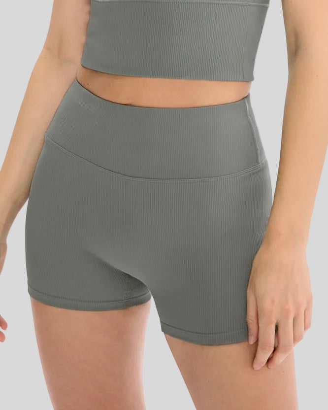 Front angle closeup of dark gray ribbed active short with wide waistband and sculpting fit
