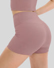Close-up of ribbed fabric and waistband on dusty pink active short