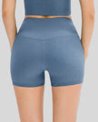Close-up of ribbed fabric and waistband on light blue active short