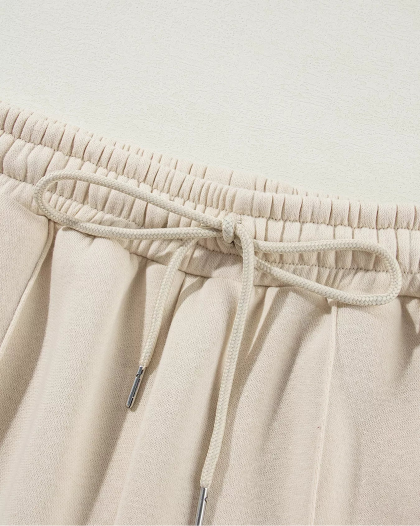Close-up of pant drawstring detail on UrbanFlow in beige
