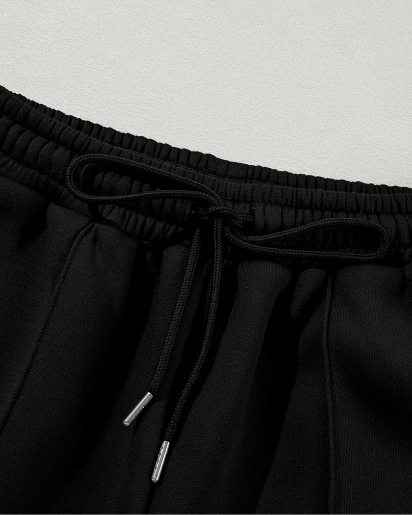 Close-up of pant drawstring detail on UrbanFlow in black