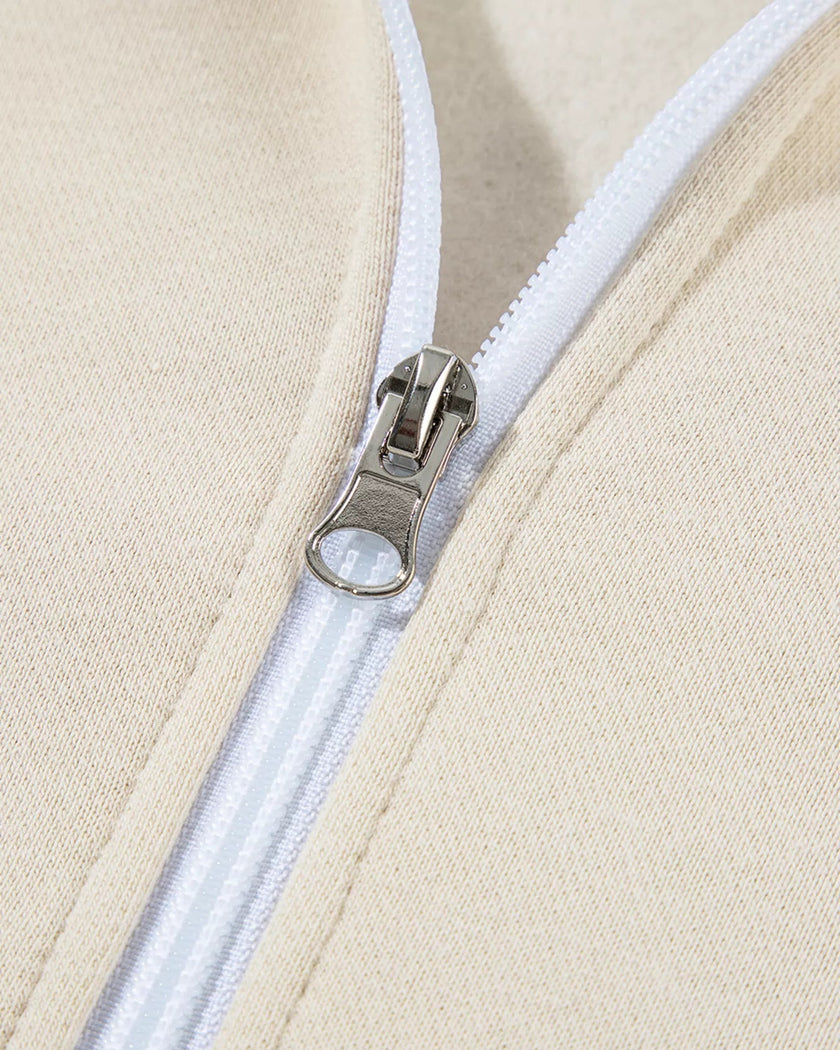Front collar close-up showing zipper finish on UrbanFlow jacket in beige