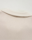 Close-up of back collar detail on UrbanFlow zip jacket in beige
