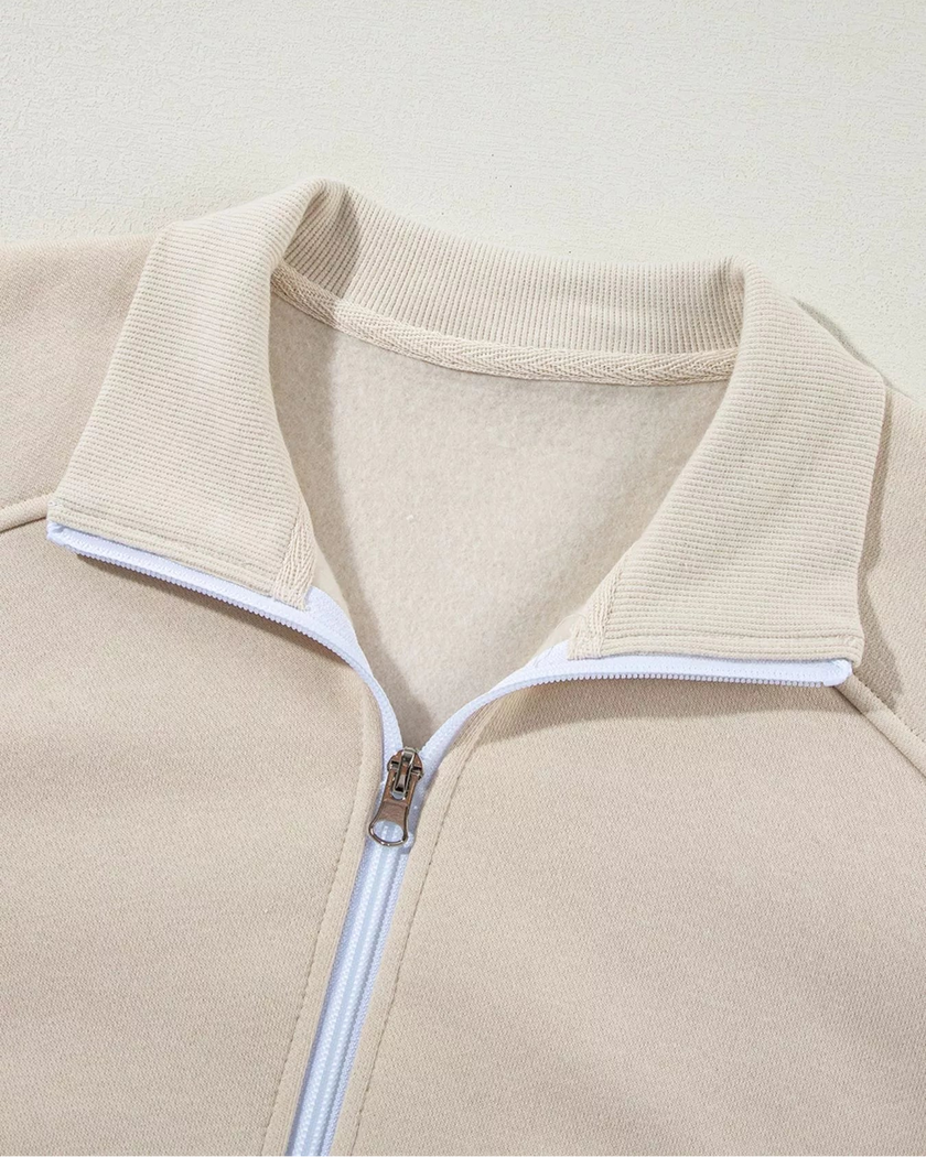 Close-up of front collar detail on UrbanFlow zip jacket in beige