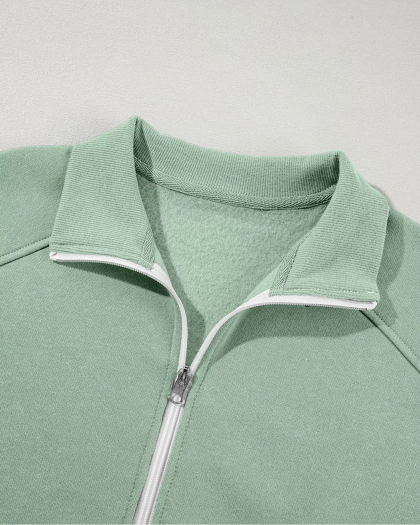 Close-up of front collar detail on UrbanFlow zip jacket in sage
