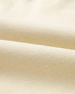Close-up of midweight knit fabric texture on UrbanFlow set in beige