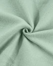 Detailed fabric texture close-up showing soft cotton-blend finish in sage