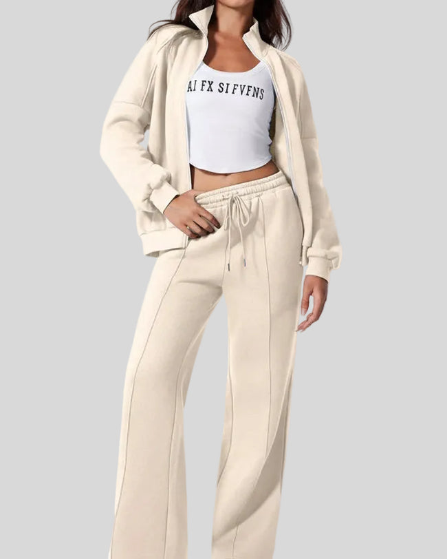 Model wearing UrbanFlow zip jacket and drawstring pants set in beige, jacket worn open