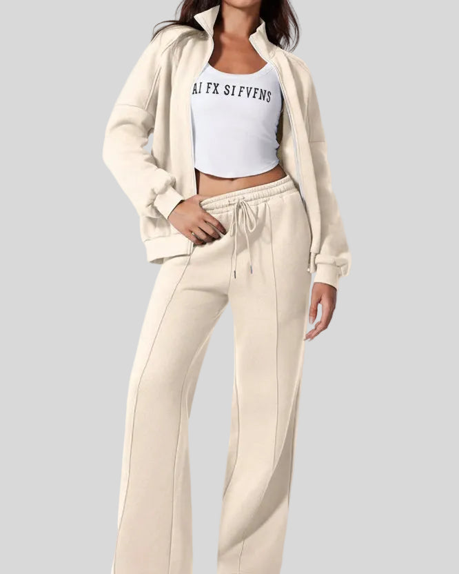 Model wearing UrbanFlow zip jacket and drawstring pants set in beige, jacket worn open