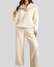 Front view of UrbanFlow zip jacket fully zipped with matching pants in beige